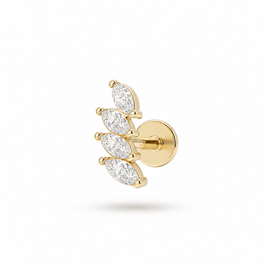 Aurelia Fan Labret piercing in gold PVD-plated titanium and surgical steel, featuring four marquise-cut cubic zirconia stones in a fan design on a threadless flat-back labret stud.