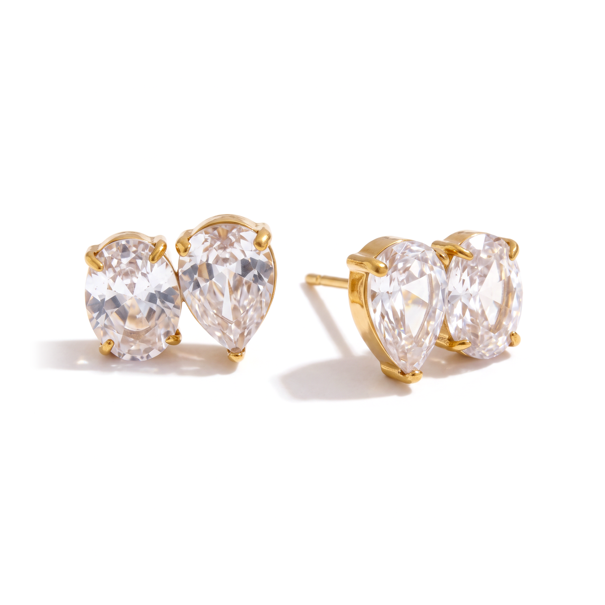 Riviera Toi et Moi Studs in waterproof PVD gold-plated stainless steel with pear and oval cubic zirconia stones and butterfly back fastening.
