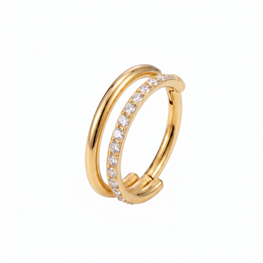 Soleil Conch Hoop in gold PVD-plated surgical steel featuring a double-hoop design with pavé cubic zirconia stones and a hinged clicker closure.