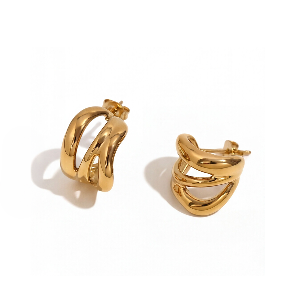 A pair of gold hoop earrings with a thick, polished, open-link design, displayed on a clean white background.